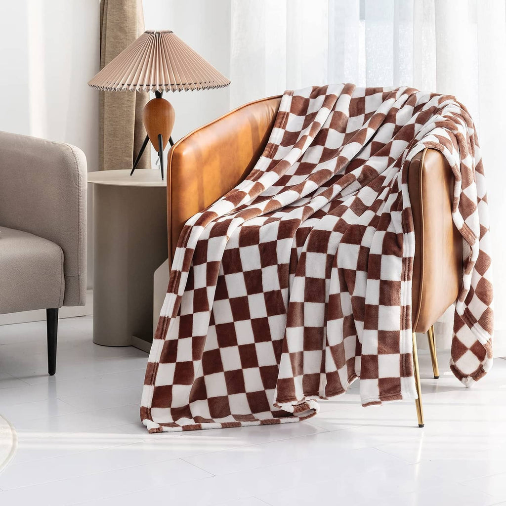 Coffee-brown and white checkerboard flannel throw blanket draped over chair back