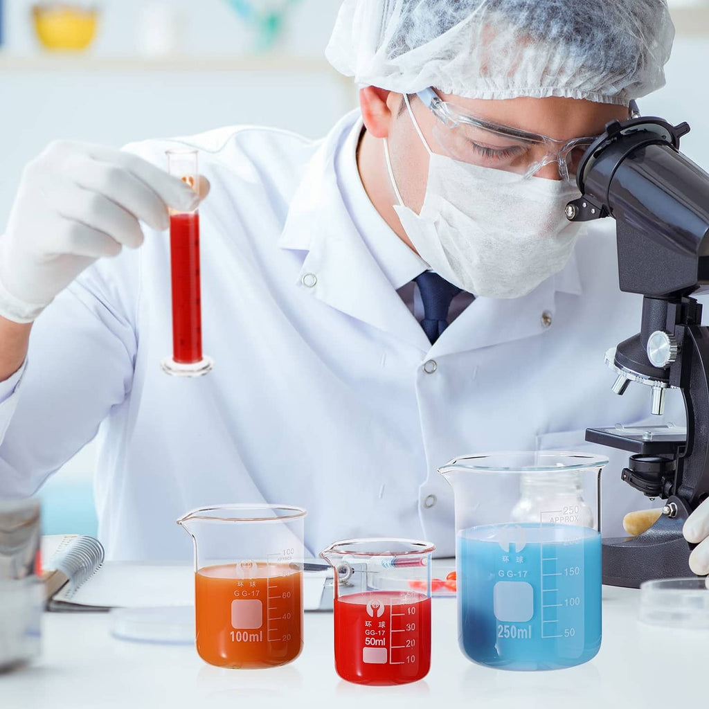Laboratory glass measuring beakers and cylinders with printed volume graduations