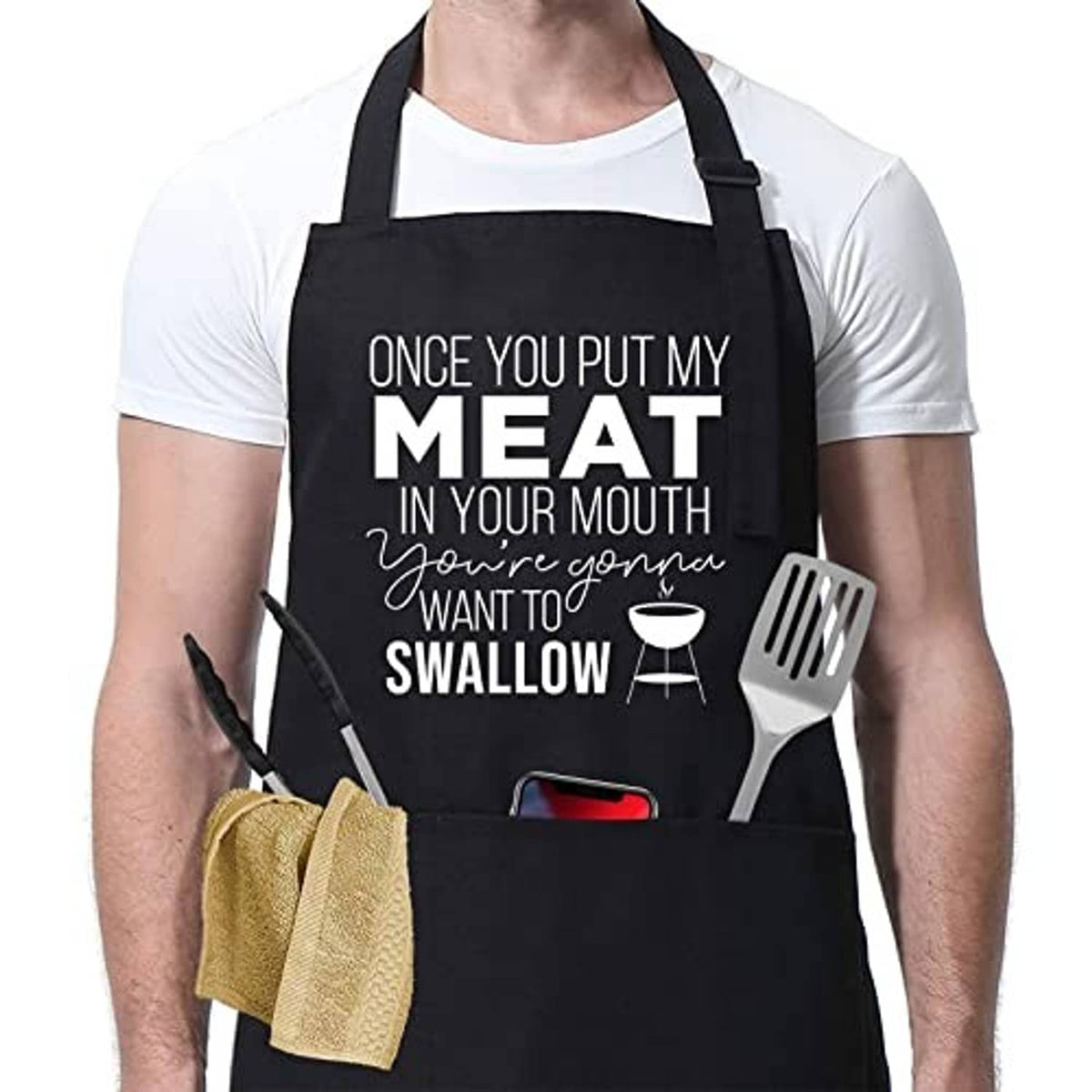 Black BBQ apron with centered "MEAT...SWALLOW" text and fork/chef utensil icon.