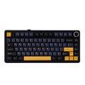 Black mechanical keyboard with orange keycaps and round volume knob