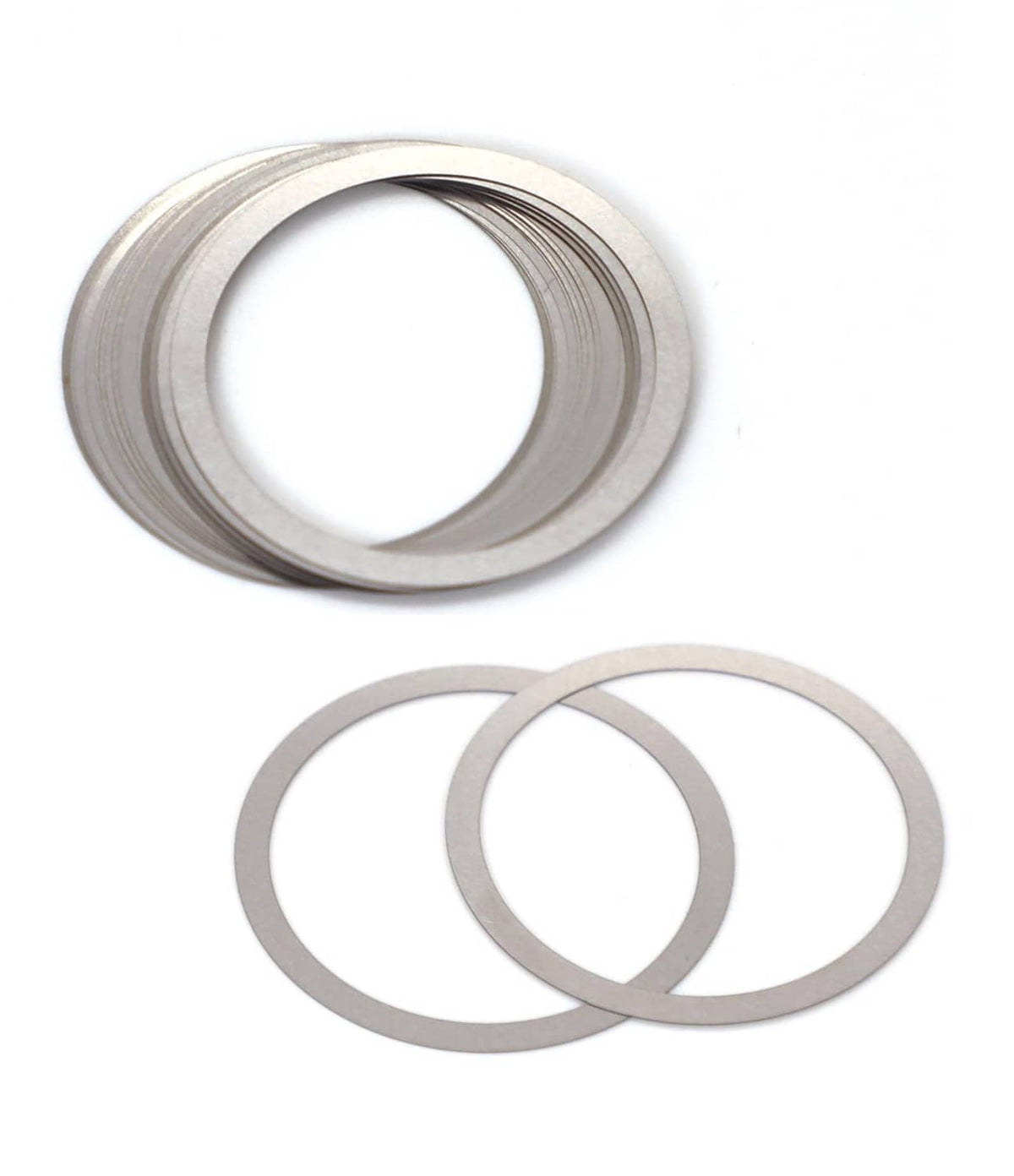 Gray shim rings, one ring stacked over two thin metal ring shims