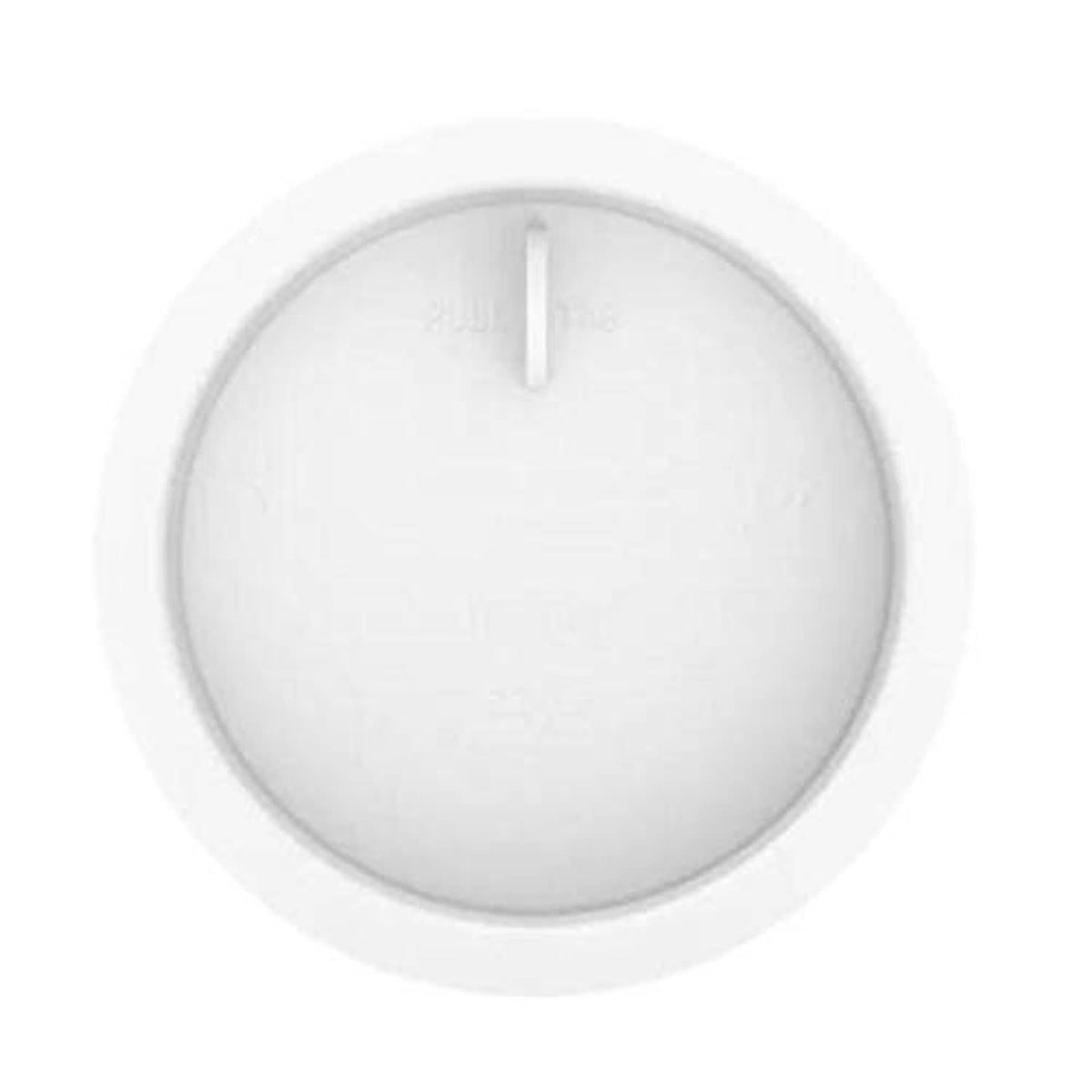 White 3-inch knockout test cap, round underside close-up with center tab