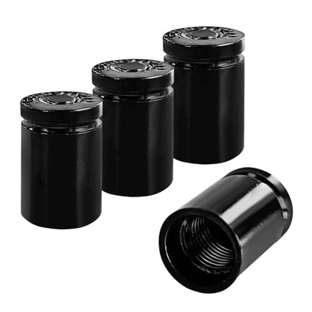 Four black bullet tire valve stem caps, plus one cap shown with visible threaded opening.