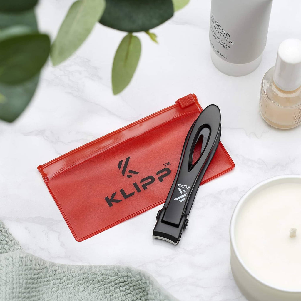 Black KLIPP toenail clippers with red storage pouch and case