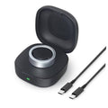 Black wireless charging case with open lid and metal charging ring, plus USB-C cable