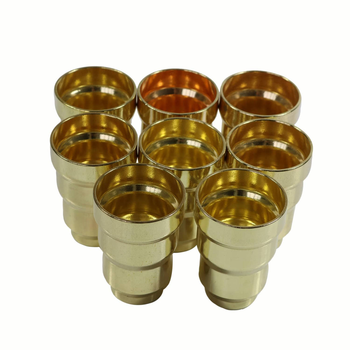 Cup-style gold brass injector sleeves with wide openings in a group