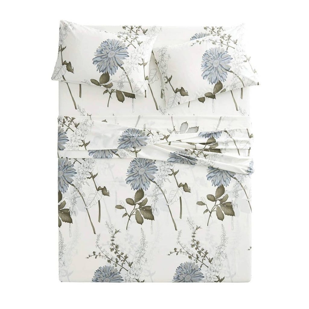 White cotton bed sheet set with blue floral botanical duvet and pillowcases