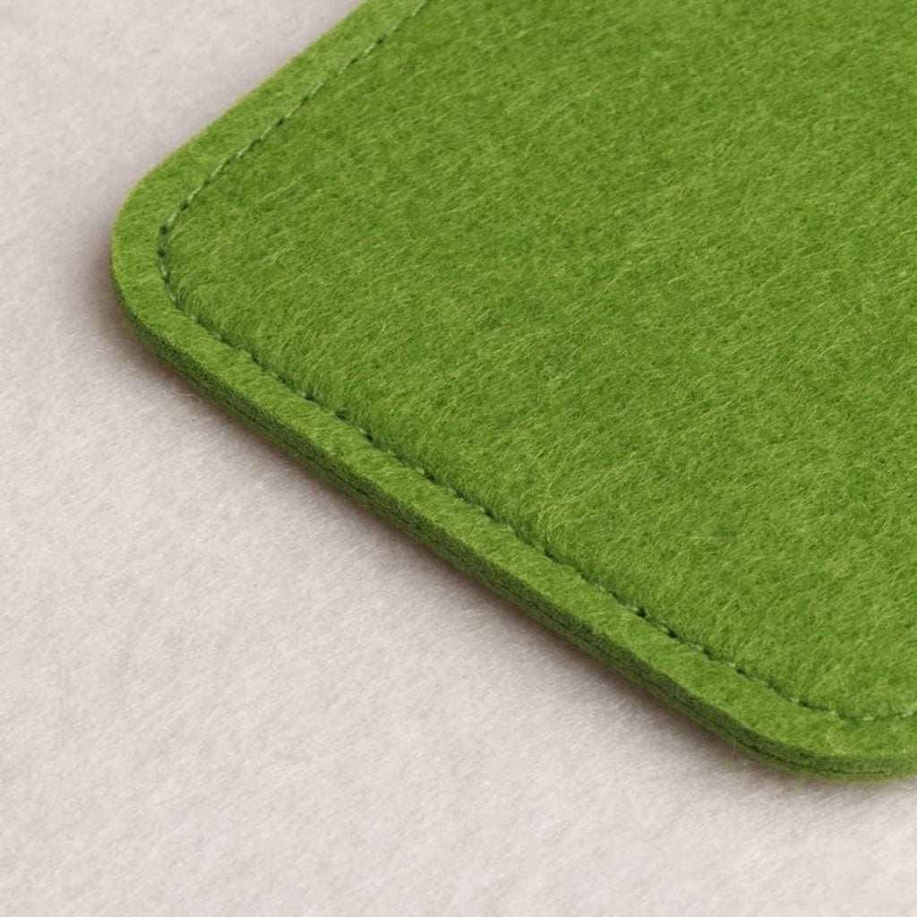 Green felt eyeglass pouch close-up showing stitched seam and rounded corner