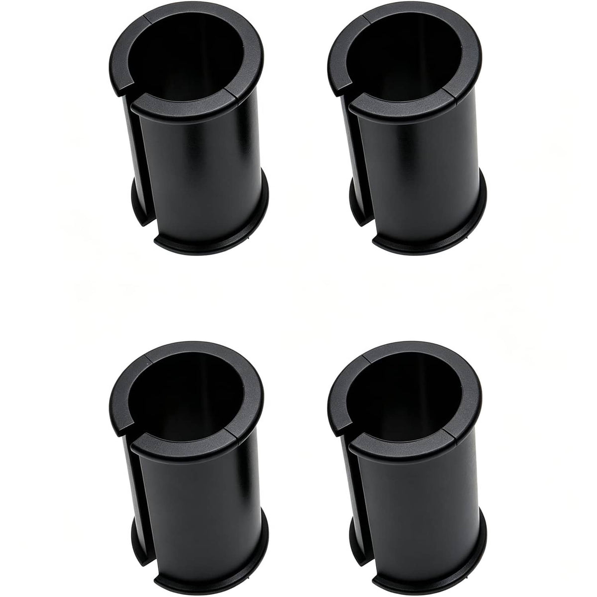 Four black shock mount rubber sleeves showing side tabs and open interior.