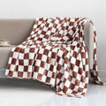 Coffee-brown and white checkerboard flannel throw blanket with fringed edges