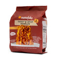 Momofuku sweet and spicy ramen noodles pouch with red chili sauce noodles inside
