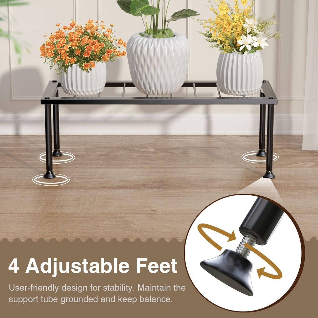 Black metal plant stand with three white ribbed planters on a slatted shelf