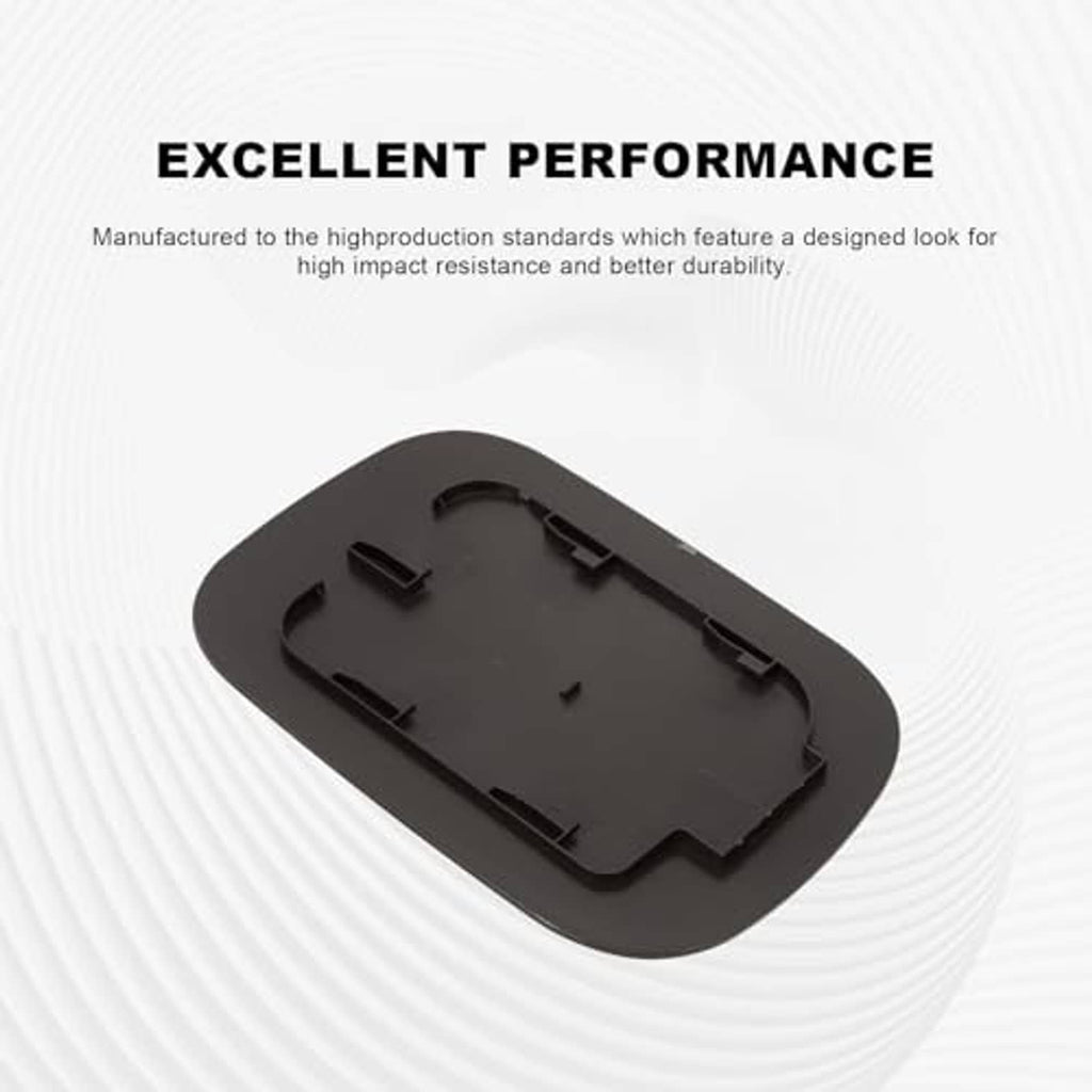Black fuel tank filler door underside with molded mounting clips, oval shape