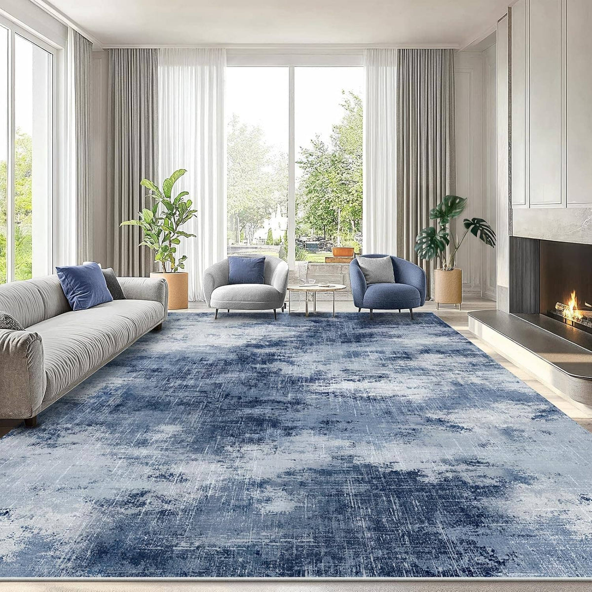 Blue modern area rug with distressed abstract pattern in a living room layout