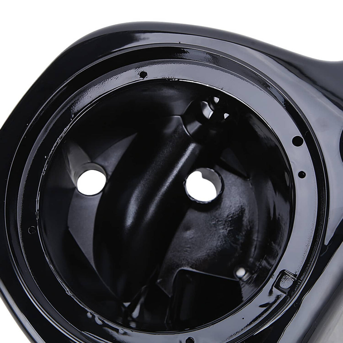Close-up of a black speaker pod box with glossy circular speaker opening