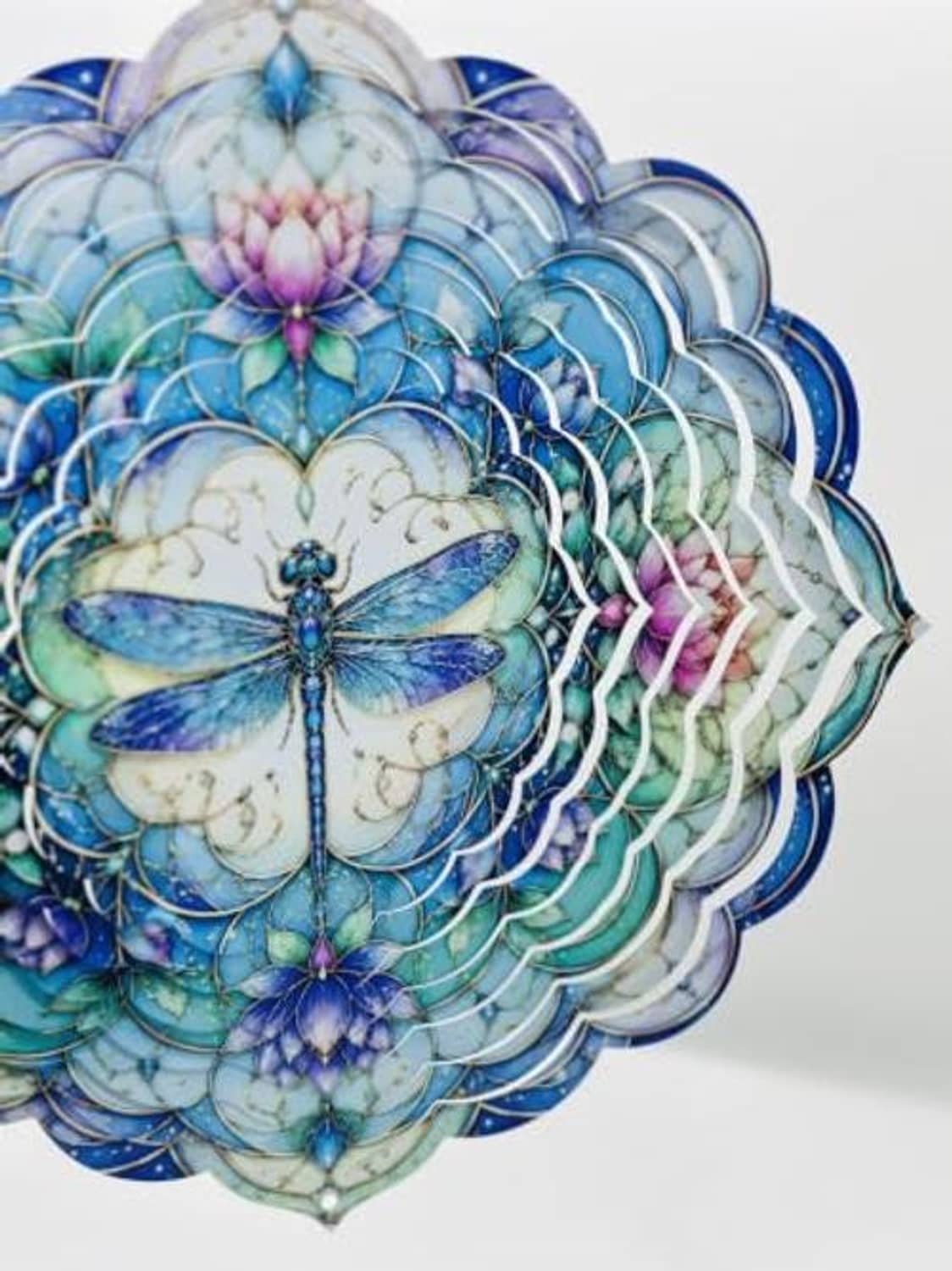 Side view hanging lotus flower wind spinner with blue dragonfly and petal details