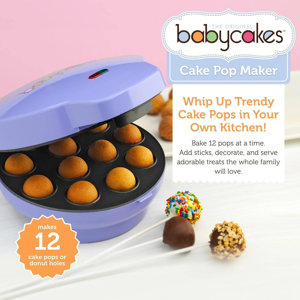 Lavender cake pop maker with open lid and black tray of golden cake balls
