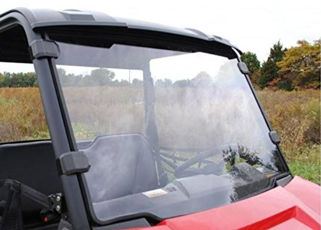 Clear windshield panel with black frame installed on red off-road UTV cab