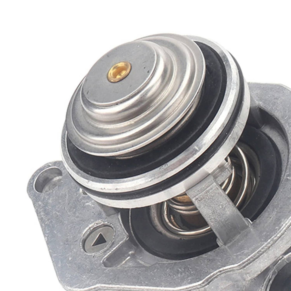 Engine coolant thermostat assembly with sensor, close-up of spring and black rubber seal