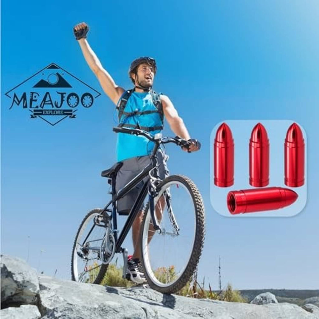 Red bullet valve stem caps displayed above a bicycle in outdoor setting