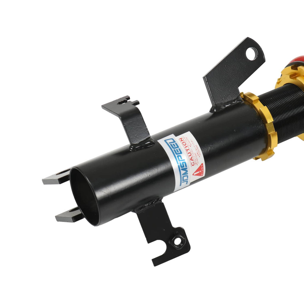 Black coilover shock absorber with red spring and gold threaded height adjuster