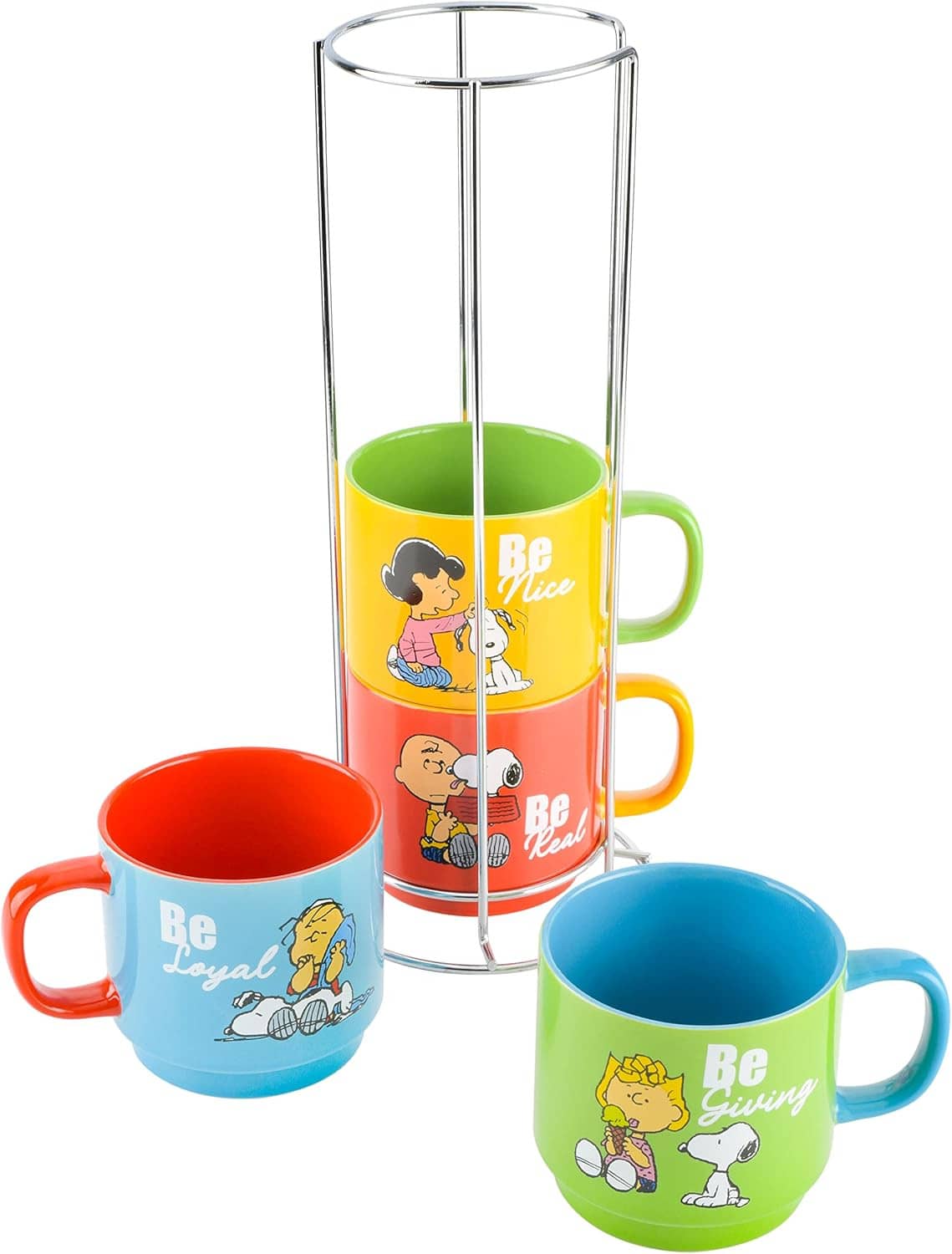 Three stackable Snoopy stoneware mugs shown with metal rack, colorful Be-themed artwork.