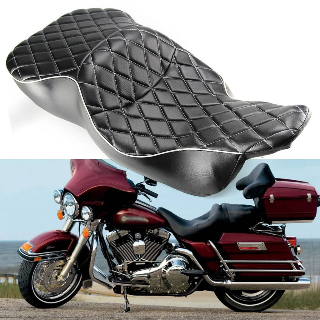 Black motorcycle seat with silver piping and quilted diamond pattern, contoured shape