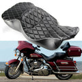 Black motorcycle seat with silver piping and quilted diamond pattern, contoured shape