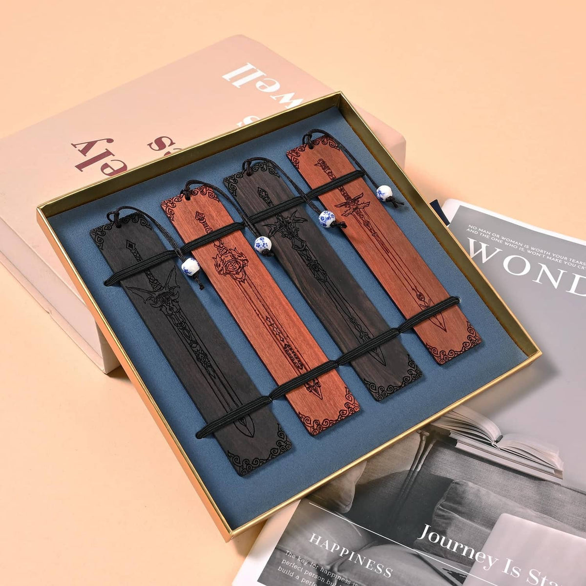 Sword bookmark gift set in open box, four bookmarks with black cords and bead charms