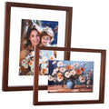 Dark walnut floating photo frame holding two photos, front view