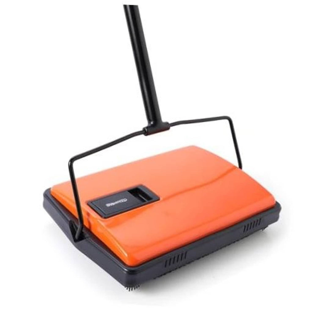 Manual carpet sweeper with rotating brush, orange top and black handle stand