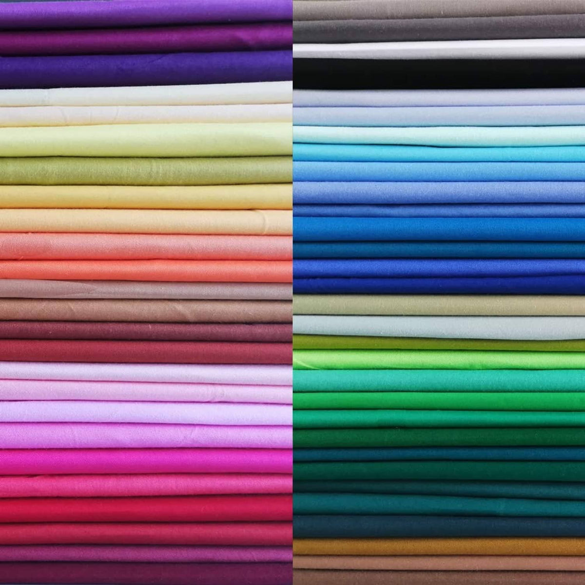 Solid-color cotton fabric squares bundle, neatly stacked in multiple colors