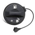Round black gas cap with fuel pump symbols and attached pull cord