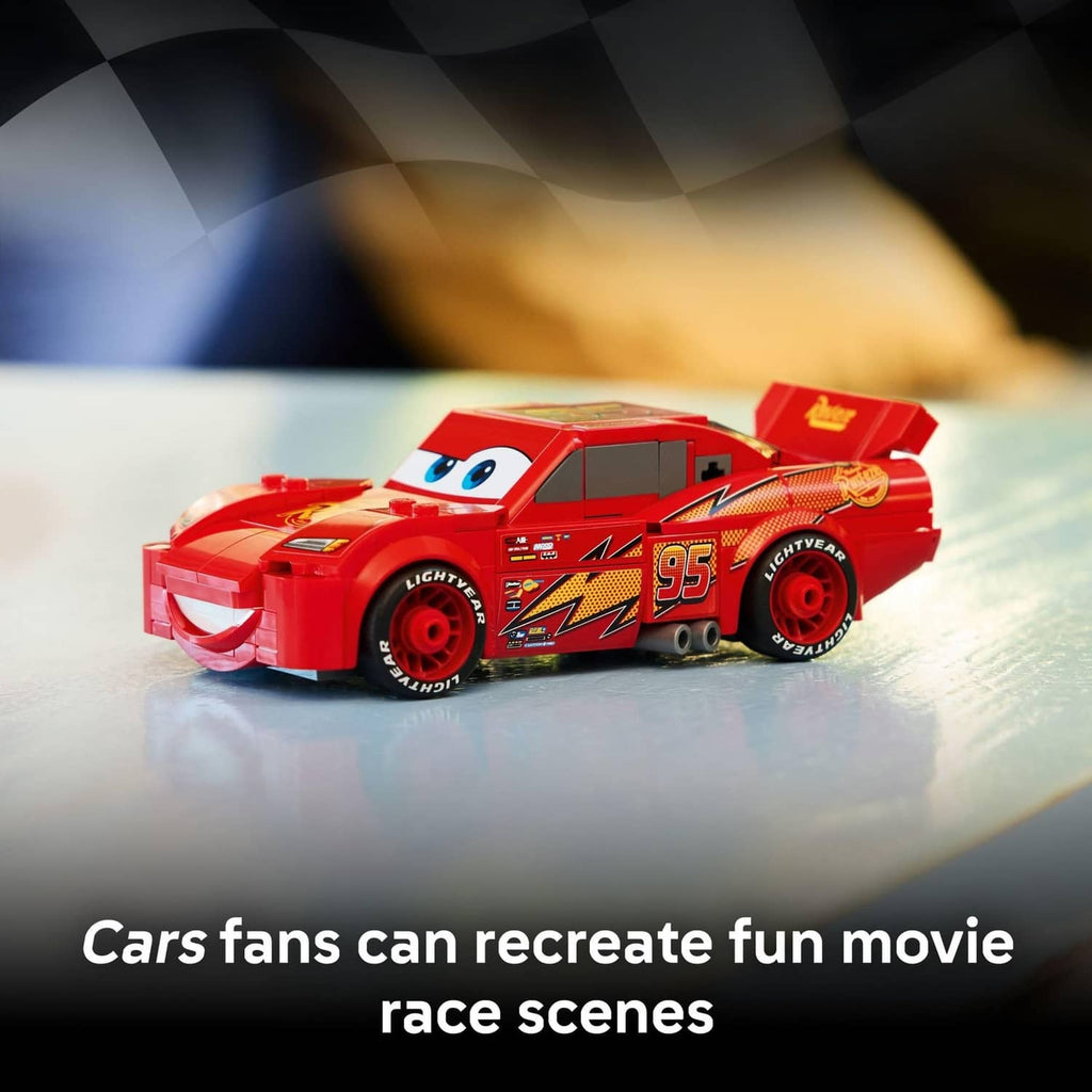 Red buildable race car toy with Lightning McQueen-style face and number 95 graphics