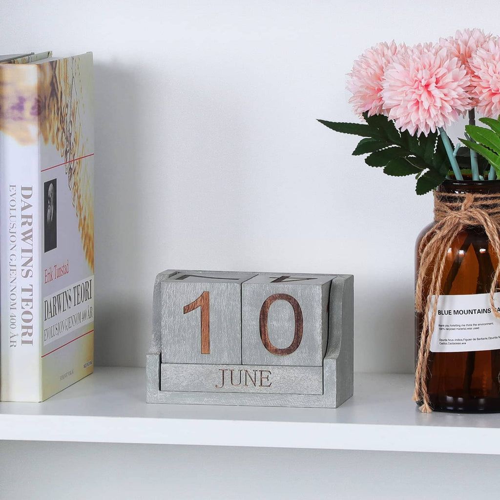 Grey desk calendar blocks showing 1 and 0 with JUNE label