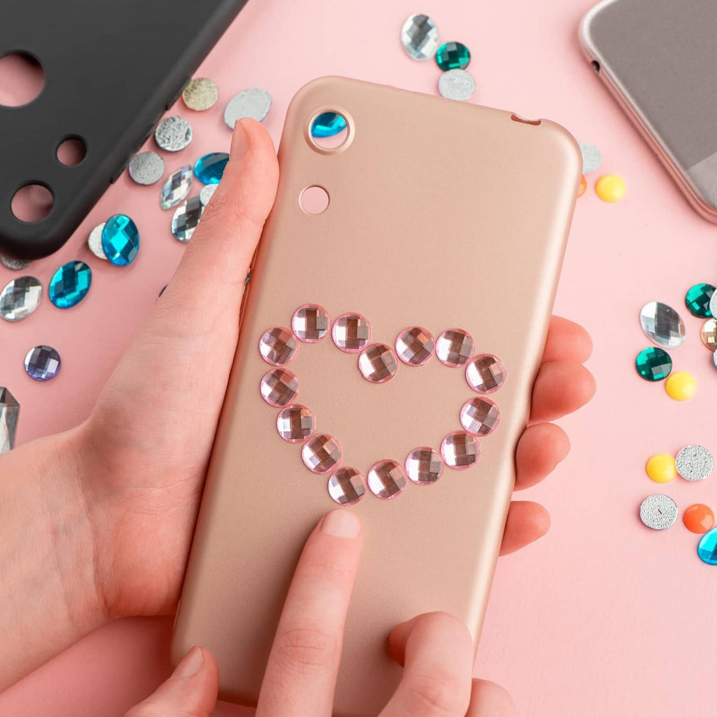 Acrylic teardrop gems arranged on a phone case, multi-color sparkling hearts