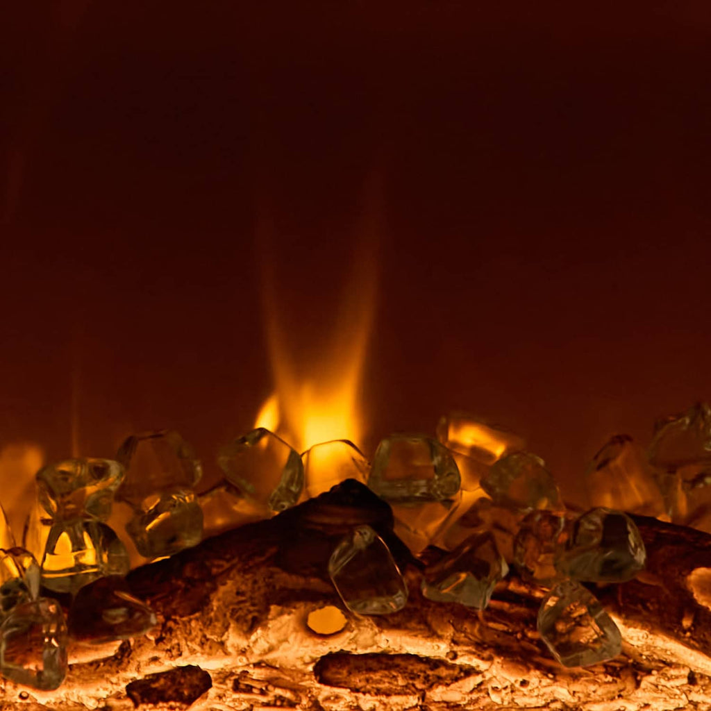 Recessed electric fireplace flame effect over dark logs with glowing embers