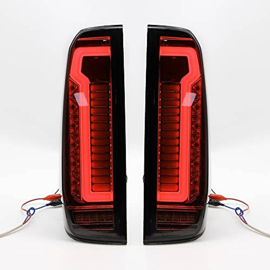 LED tail light assembly pair with red illuminated vertical bars and red outer lenses, black housing