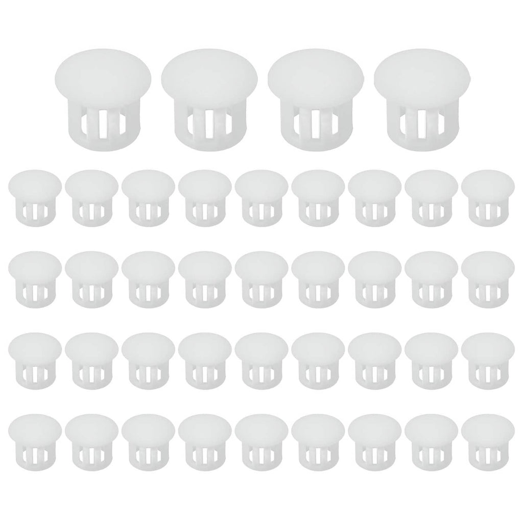 Set of white round plastic flush hole plugs arranged in rows