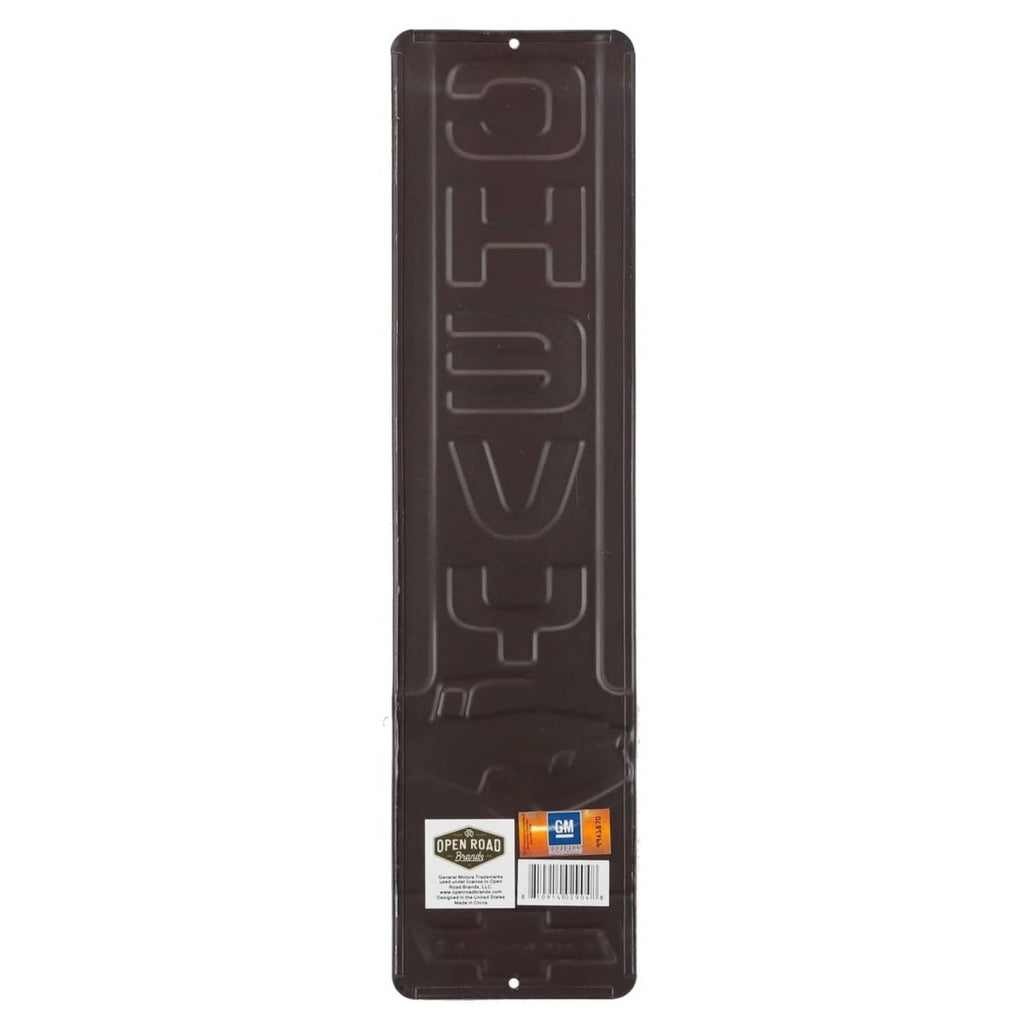 Chevrolet vintage embossed metal wall sign, back side with mounting holes and label.