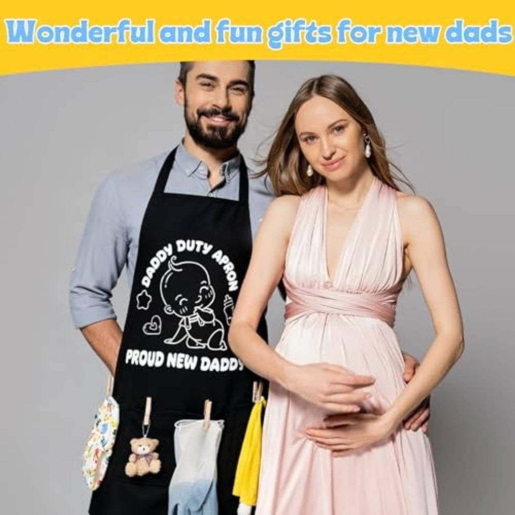 Black dad apron with printed cartoon graphic, worn by expectant father