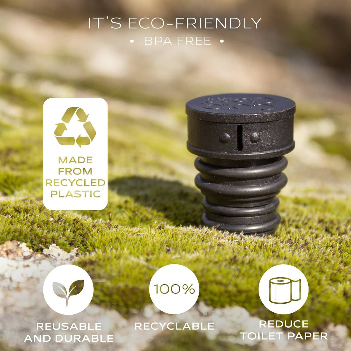 Black portable bidet cartridge on grass with threaded nozzle top