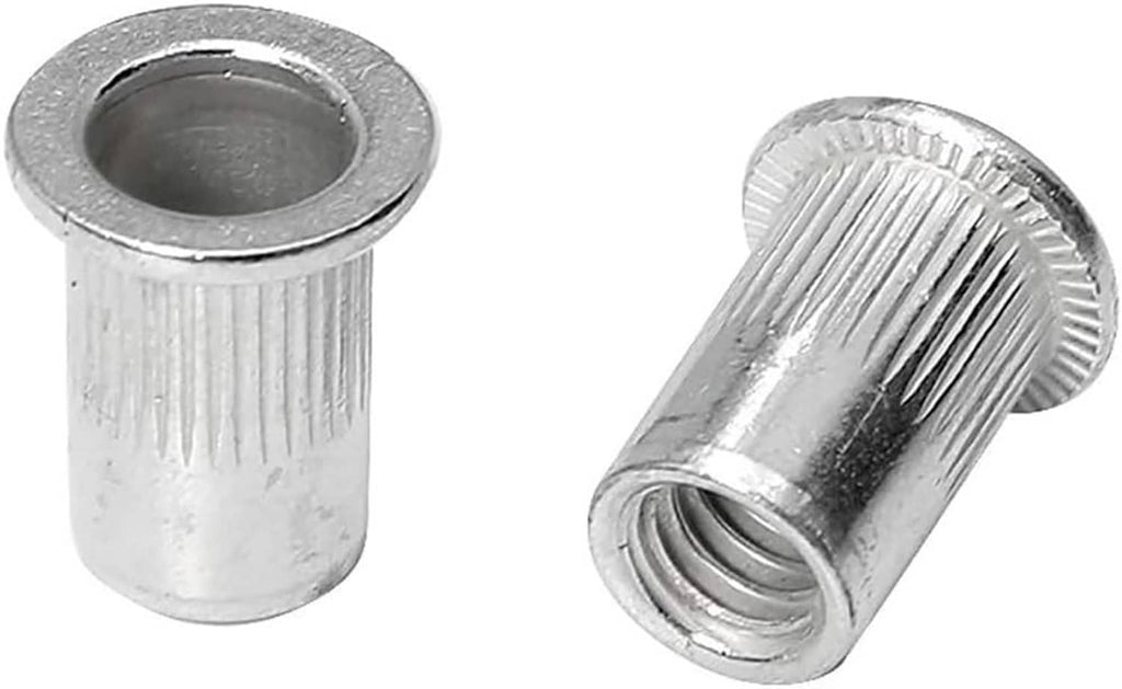 Close-up of silver aluminum rivet nuts, knurled cylindrical body with threaded center