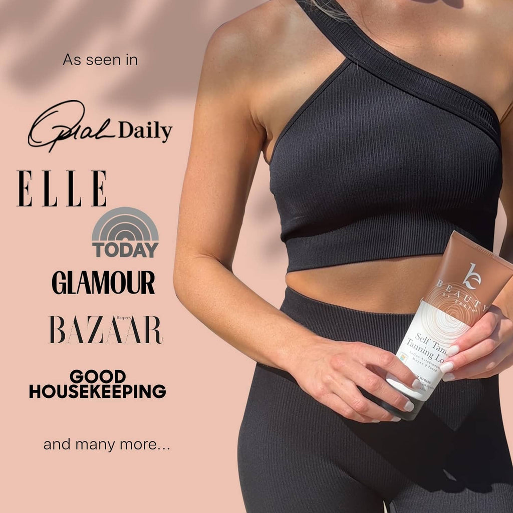 Woman holding self-tanner lotion bottle near waist, one-shoulder outfit