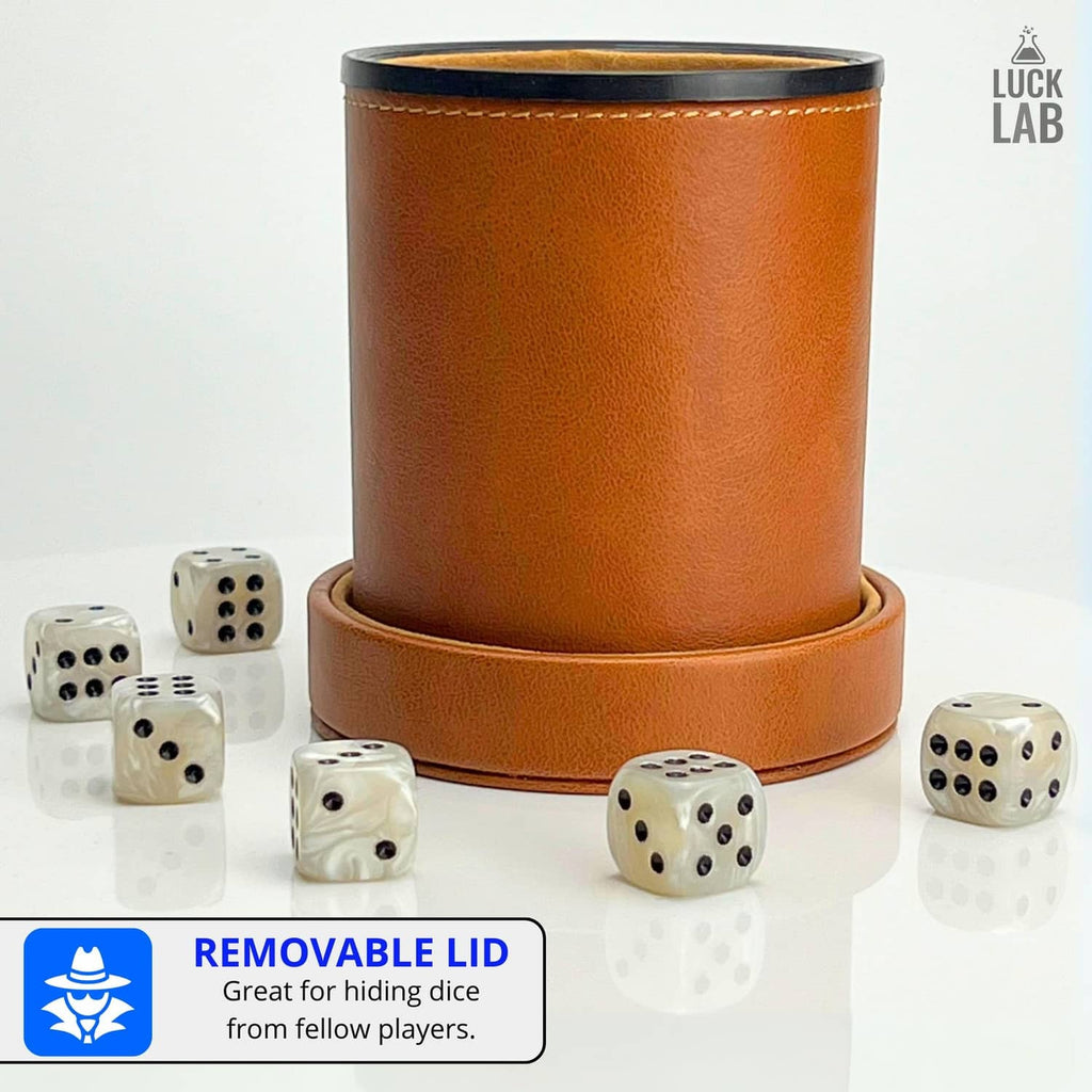 Brown leather dice cup with removable lid showing 6 tan dice, with felt interior