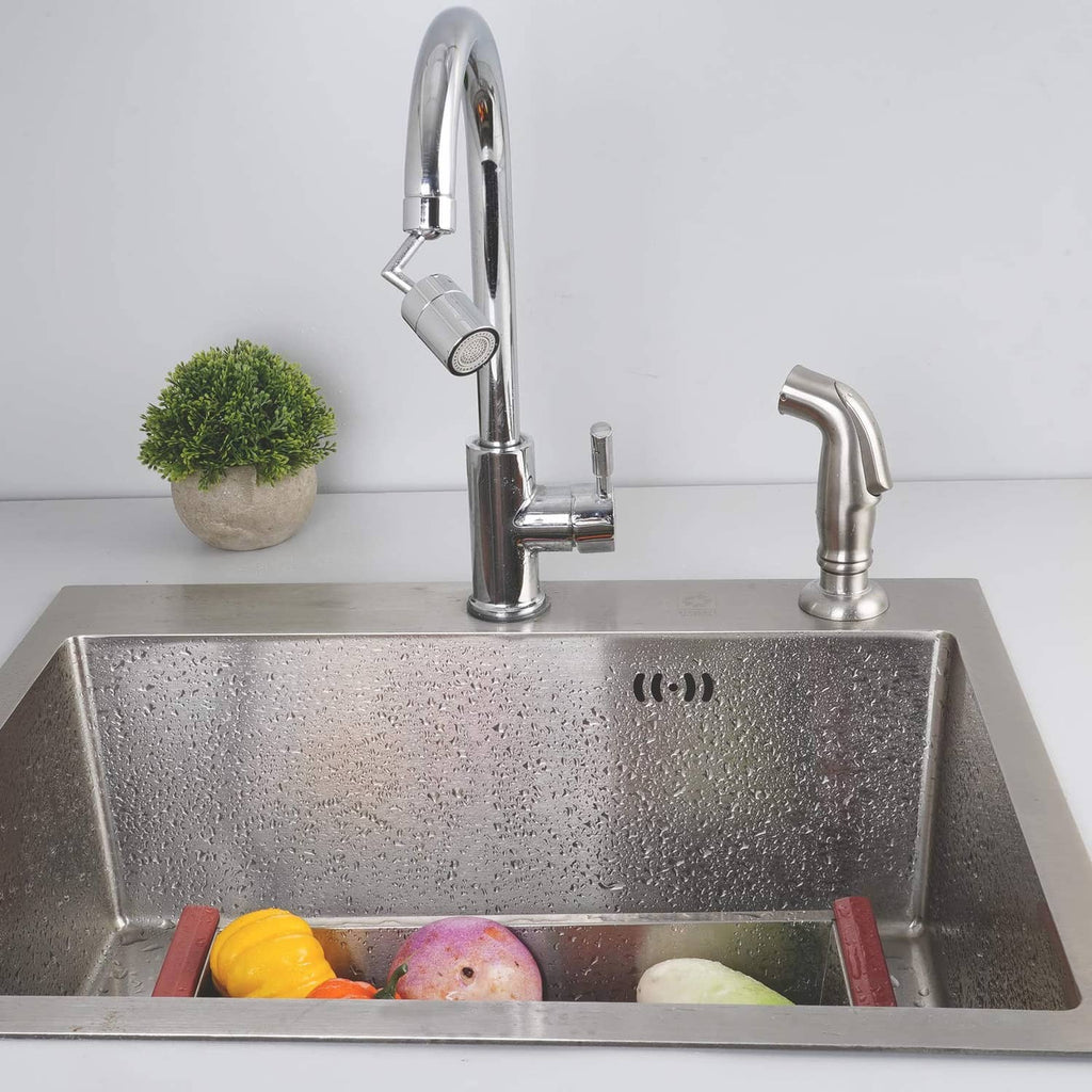 Brushed nickel pull-down sprayer faucet mounted over stainless steel sink