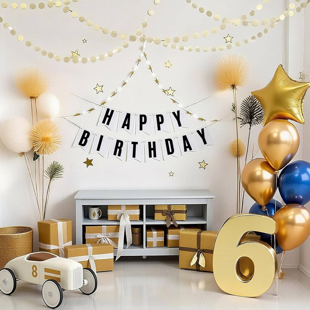 Black letter stickers spelling HAPPY BIRTHDAY on a banner with gold balloons
