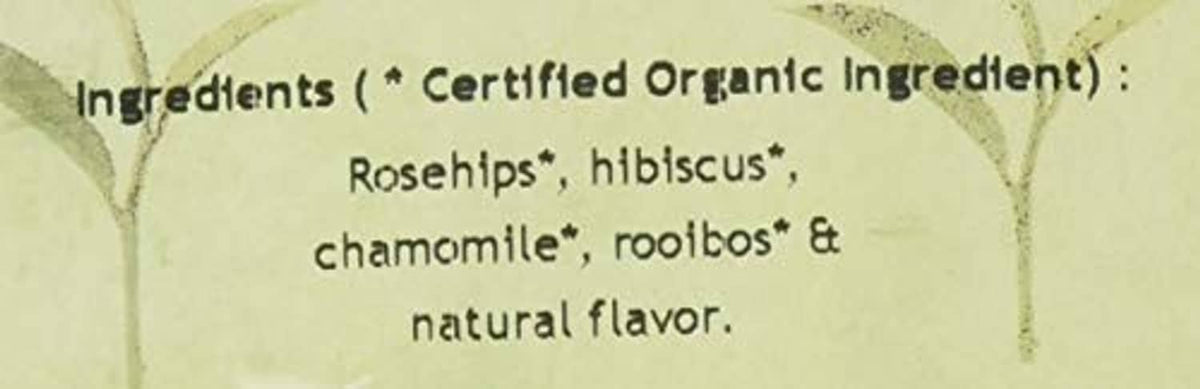 Herbal berry essence tea ingredient text close-up: rosehips, hibiscus, chamomile, rooibos