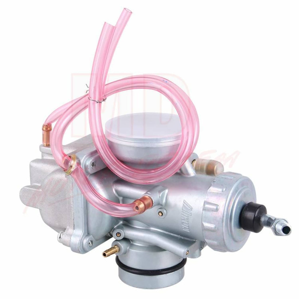 Silver carburetor with round air intake and pink fuel hose loop, side view