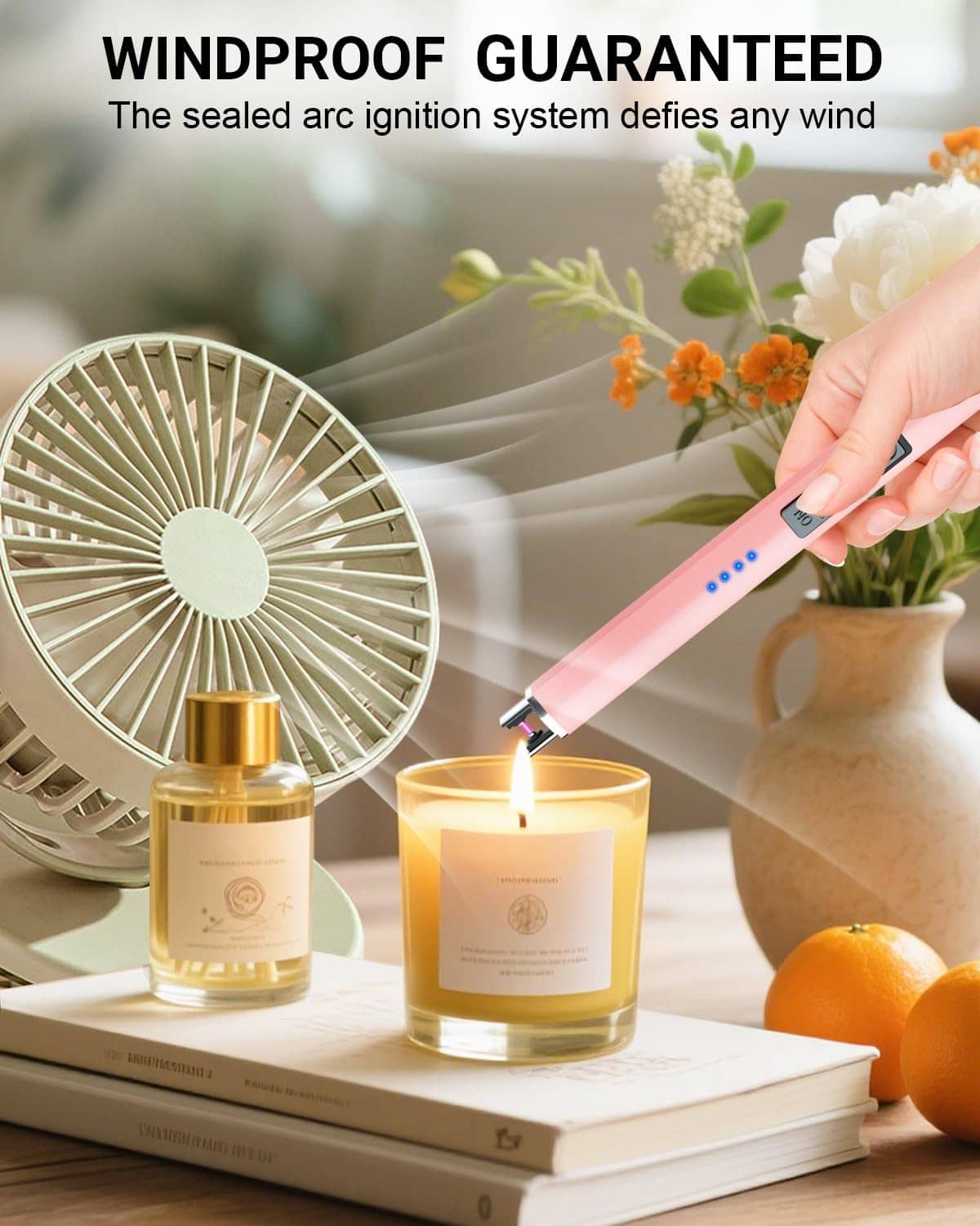 Rose gold electric candle lighter igniting a candle with an arc spark